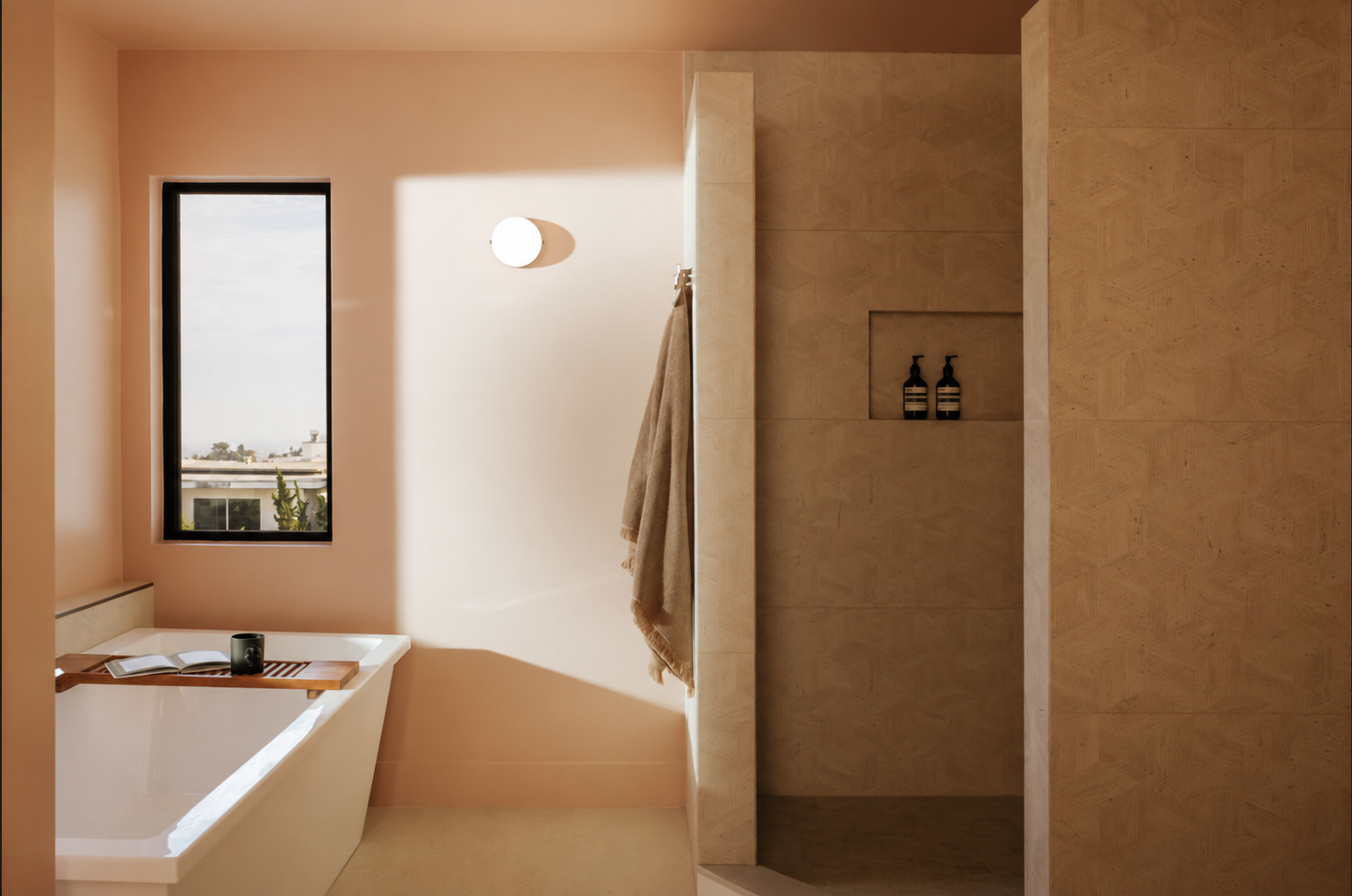 Bathroom with a freestanding tub and warm plaster walls at Venus Drive