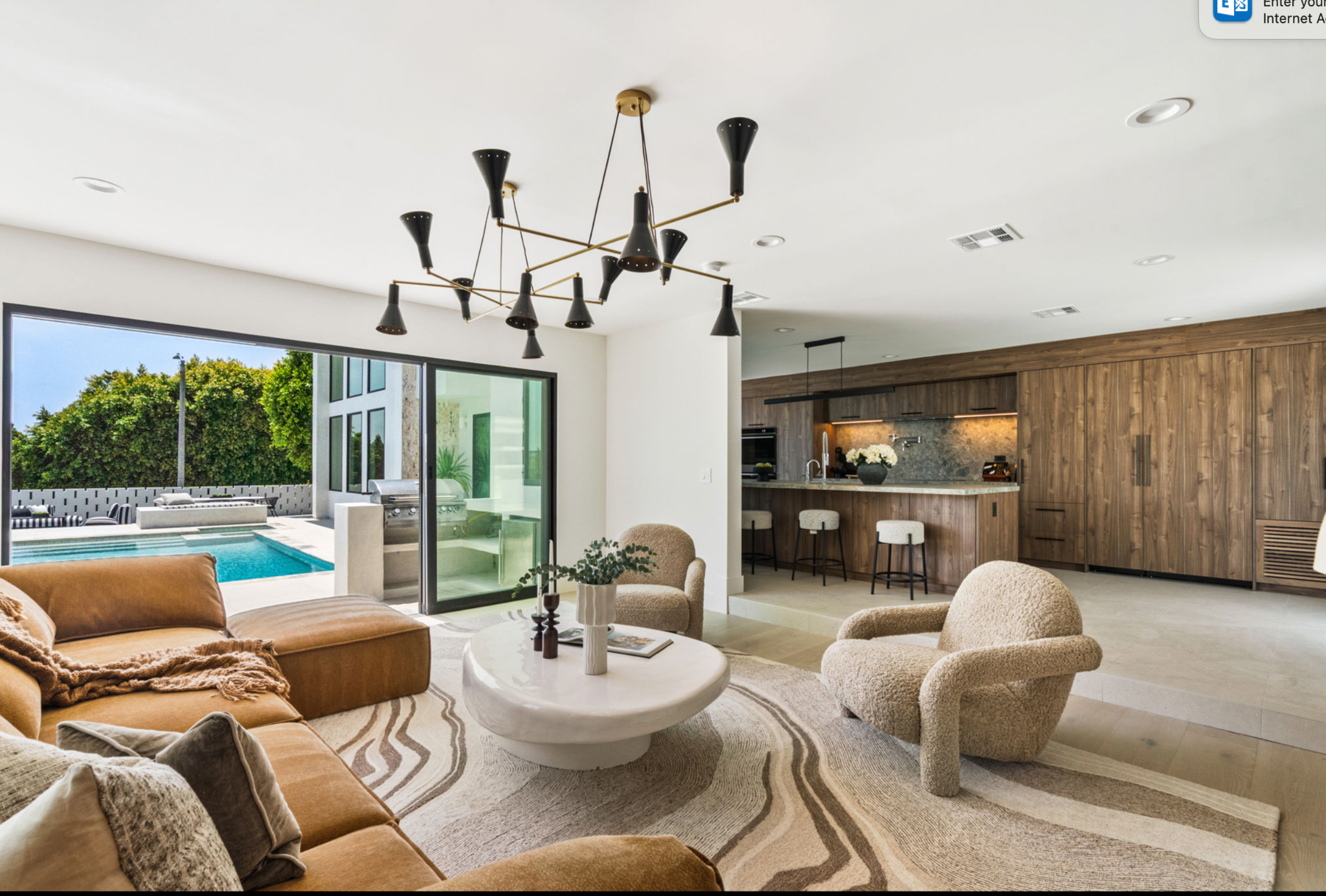 Living room, walnut kitchen and pool at Venus Drive